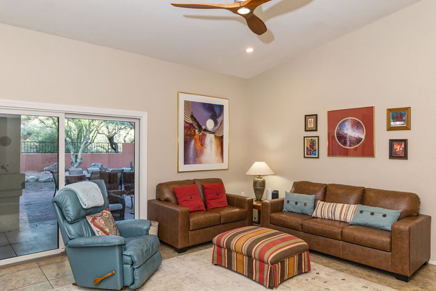Beautiful family room with ample seating, recliner chair, sliding door to back patio