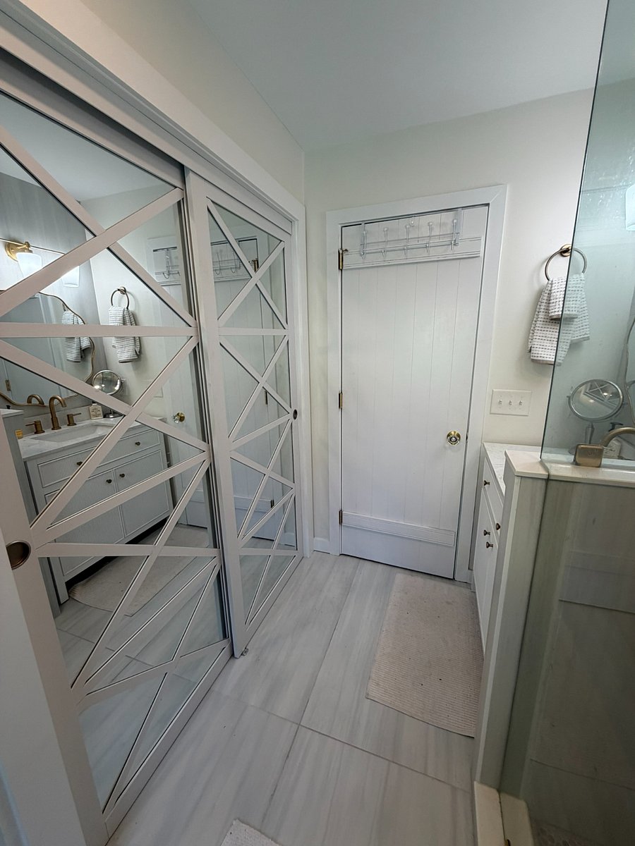 First Floor full bath with closet storage and washer-dryer