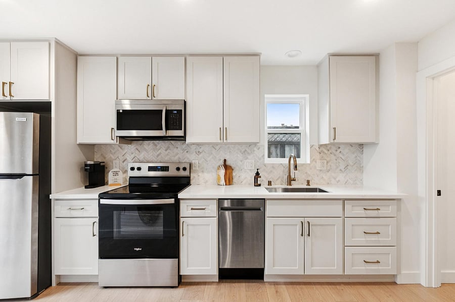 Kitchen includes full size fridge, microwave, electric stove/oven, and dishwasher, all dishware, utensils, keurig, pots and pans, and blender.