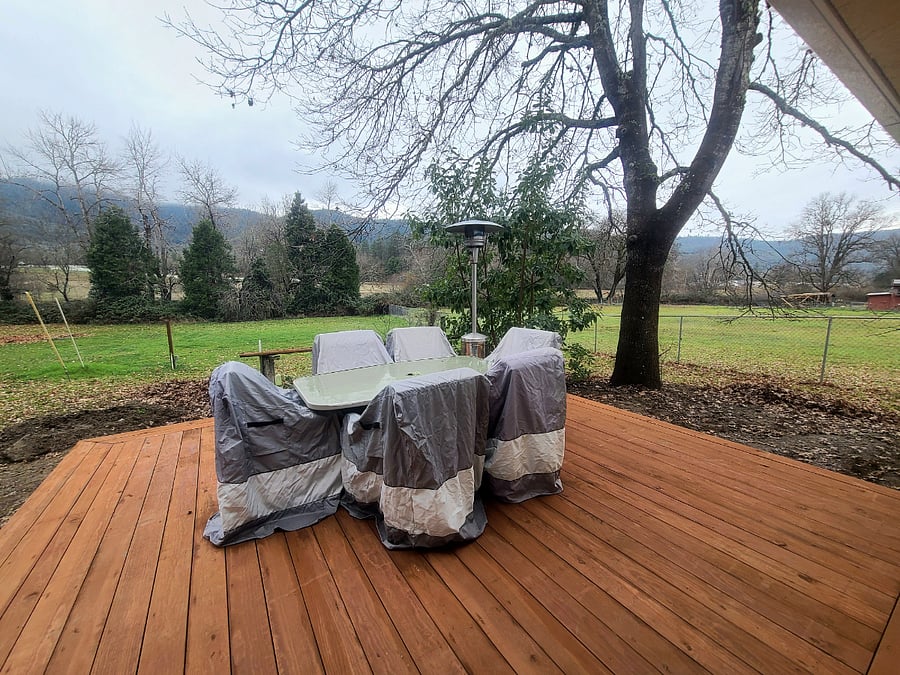 Private deck with mature trees, grape vines, and landscape views.