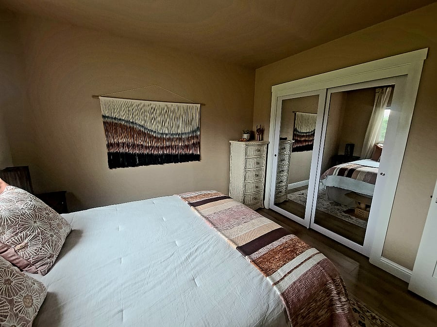 Bedroom features large 8 ft. mirrored closet.