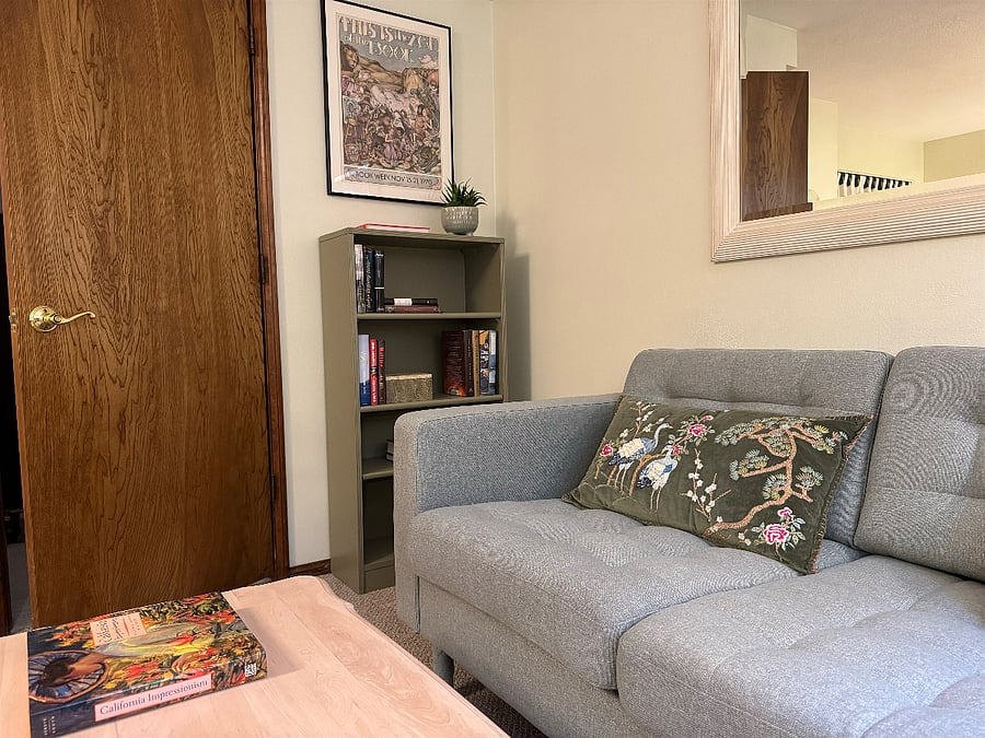 Beneath the vintage National Book Week poster (art by Maurice Sendak) is a 1930s bookcase with a selection of hardcover novels--and room for your own books, if you're a reader.