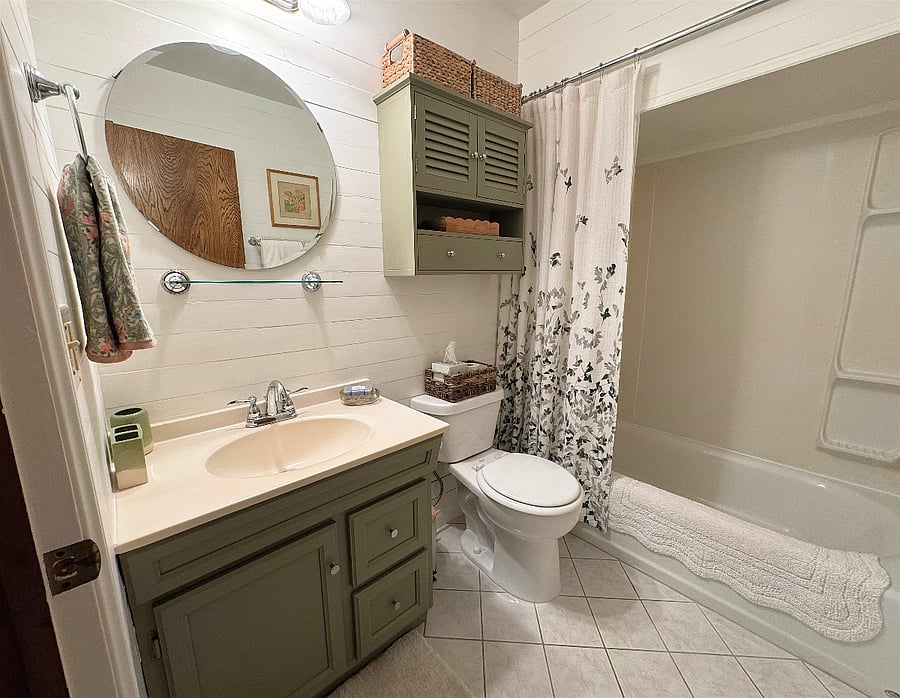 ***ALERT! THE SHOWER CEILING IS ONLY 6' HIGH. If you're over 5'10", I think this would be difficult for you to manage*** The sweet bathroom isn't huge, but it offers lots of storage space, and the shower has excellent water pressure.