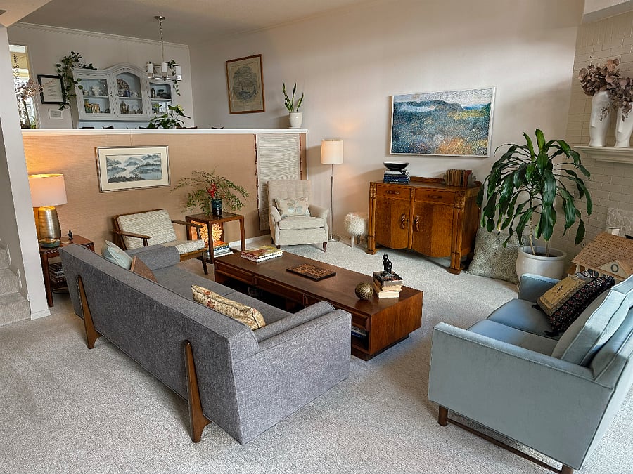 A Samsung Frame TV hangs above the vintage 1940s sideboard. All other furniture has been passed down through the generations.