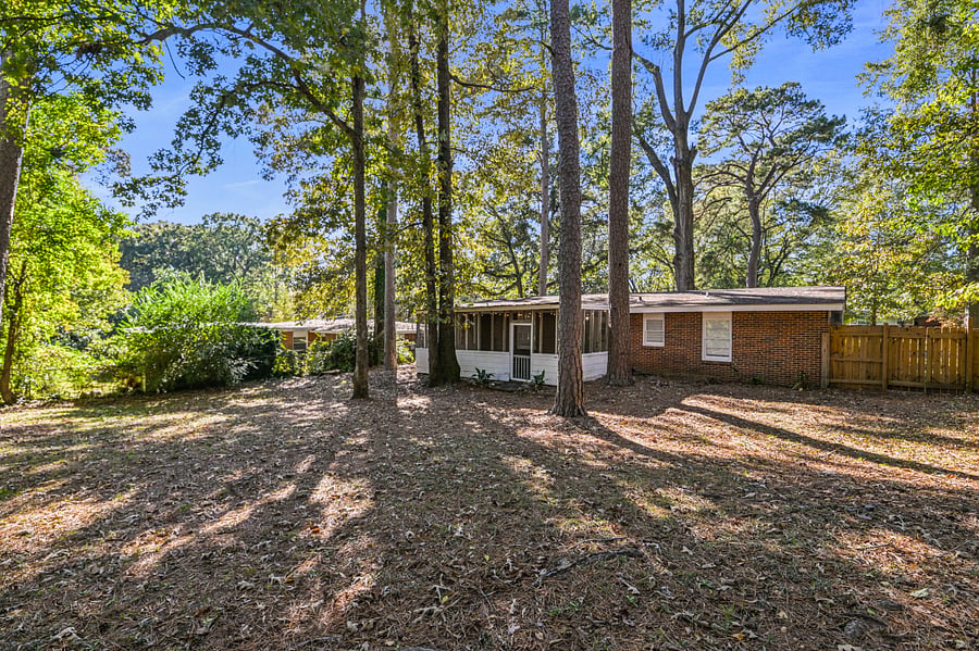 Well-maintained landscaping and mature trees provide a serene and private atmosphere and fully fenced in backyard.