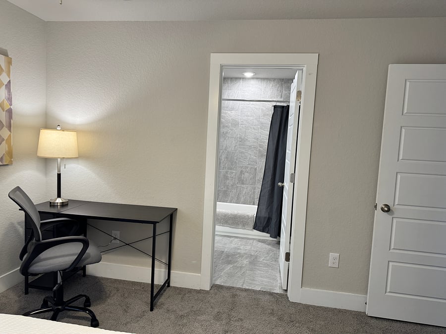 Bedroom 3: queen bed, desk, ensuite bathroom
