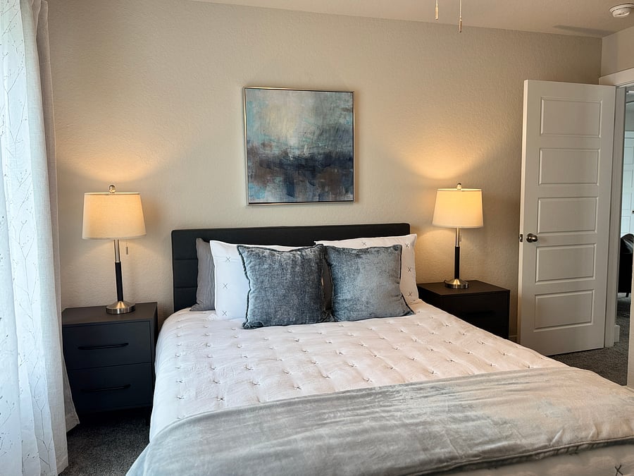 BEDROOM 2: features a queen bed, desk, chair and ensuite bathroom.