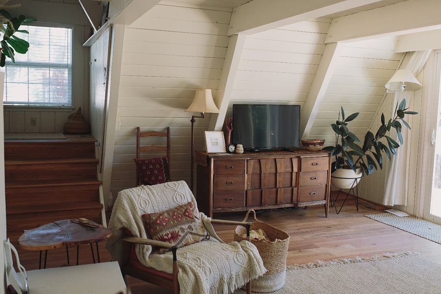 Many furnishings are vintage or antique, making the home feel personal and unique