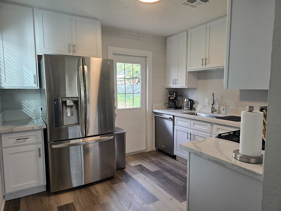 Stainless Steel appliances with gas range. 