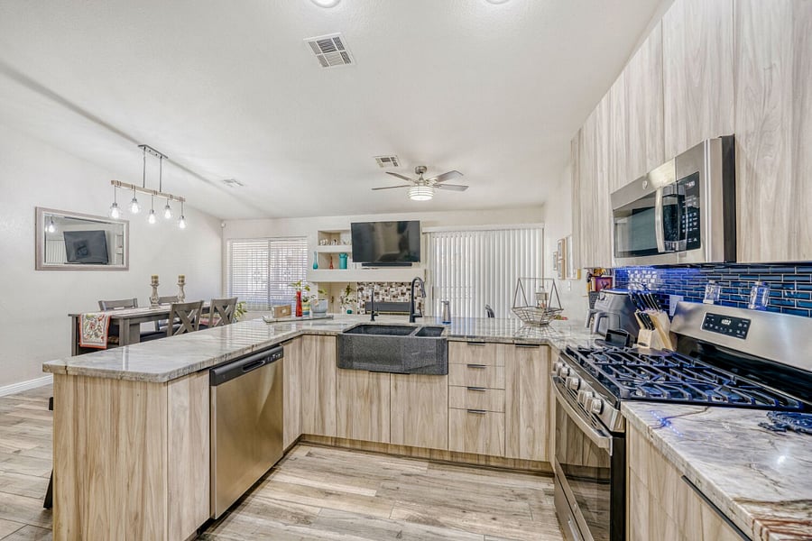 Kitchen fully equipped with dishes, pots, pans, counter top appliances and more