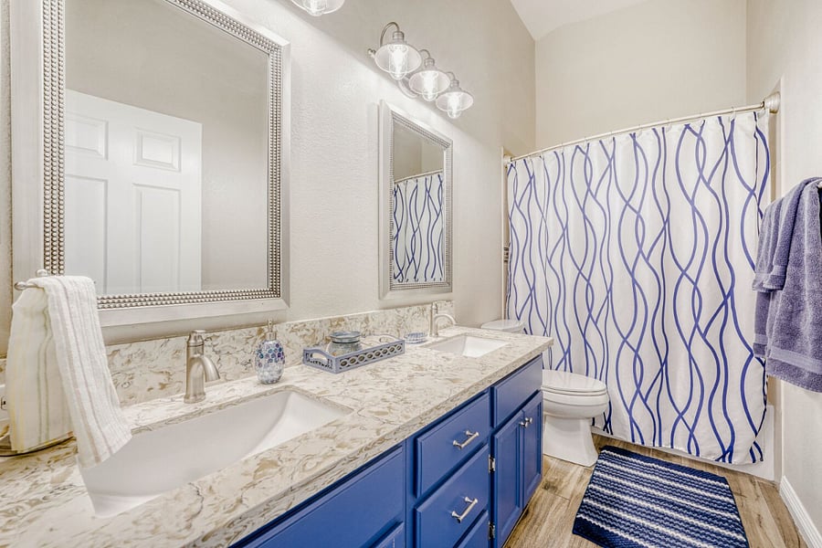 Hallway Bathroom includes a double vanity and shower/tub combo