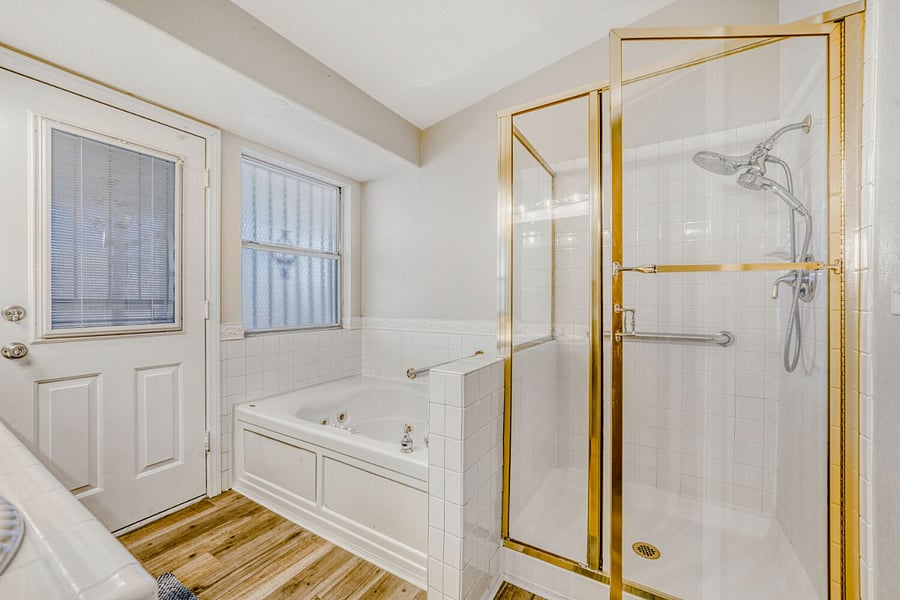 Primary bathroom with separate tub and shower