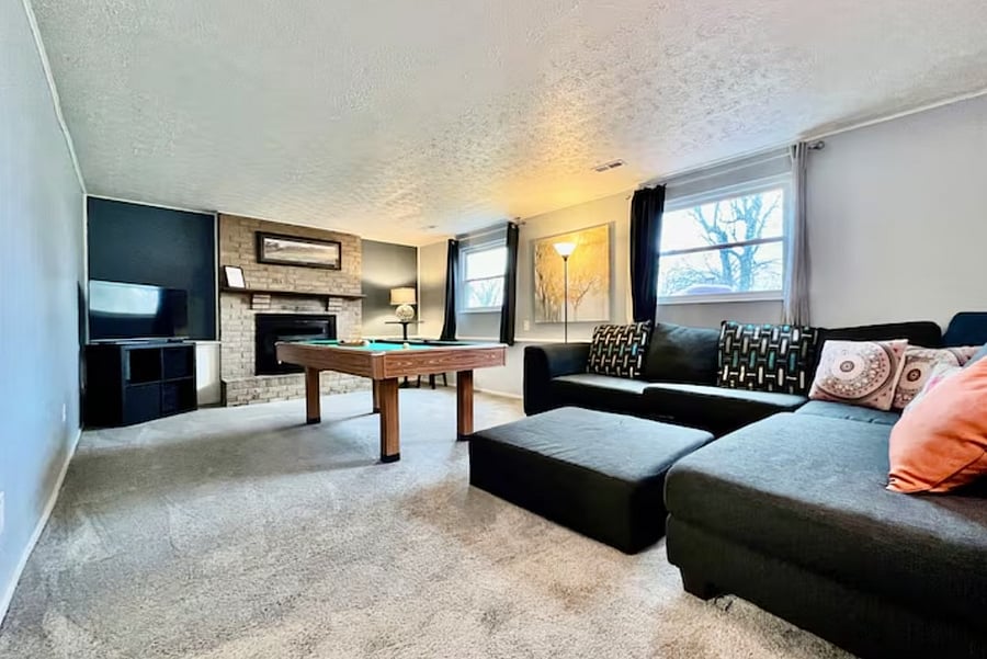 Secondary living room with fireplace and seating