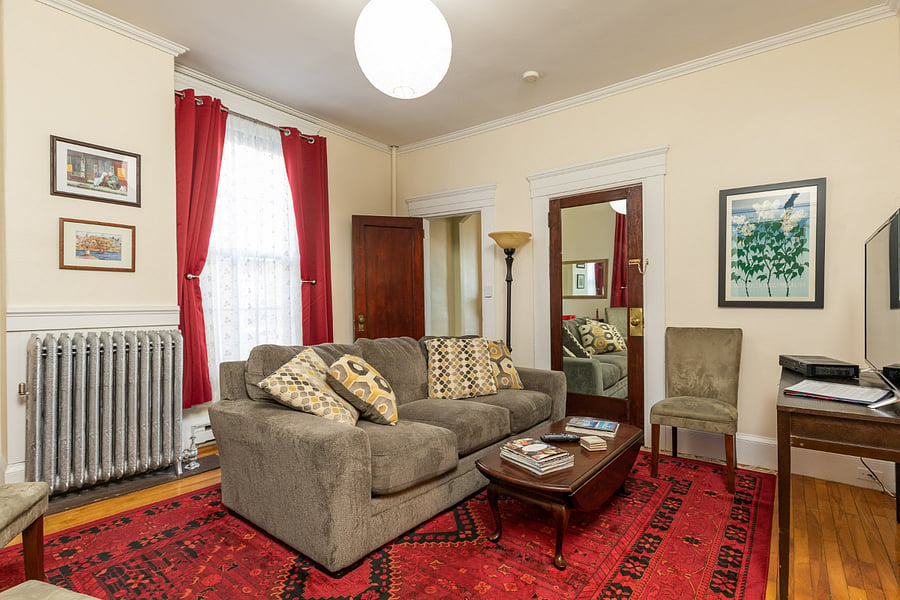 Living room view. Bedroom is through door in the center of photo.
