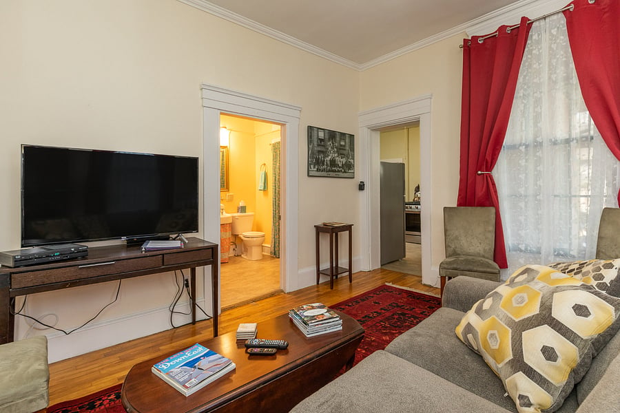 Another view of living room. Bathroom is through left door. Kitchen is through right door.
