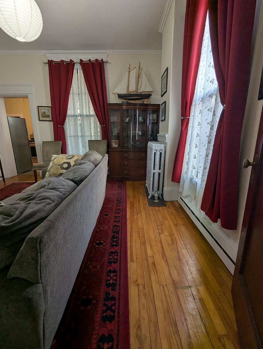 View of living room, looking from bedroom door.