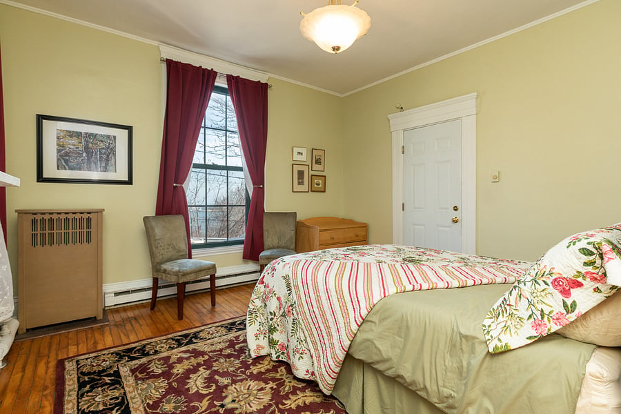 Another view of bedroom, with room-darkening curtains.