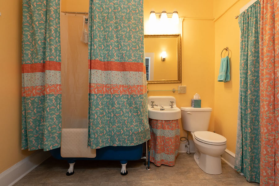 Bathroom, with claw-foot tub and shower.