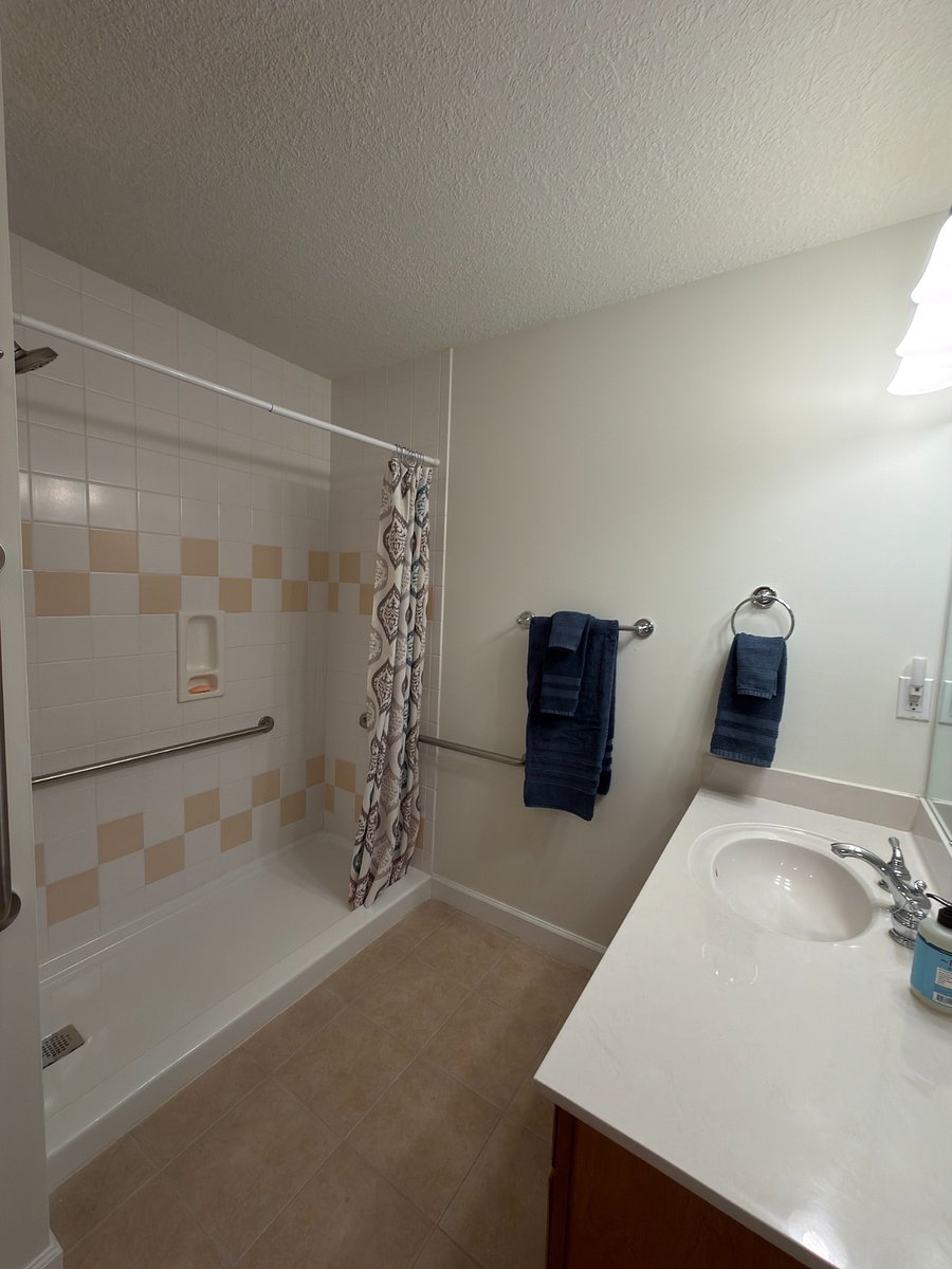 Tile shower with grab bars