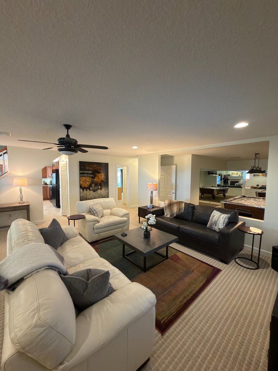 Living room looking at kitchen, hallway and pool table room