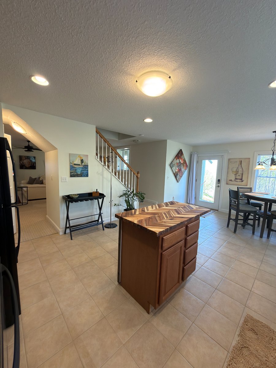 Kitchen looking at entrance and dining area
