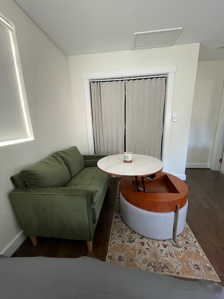 Convertible coffee table-to-desk with storage for laptop and devices.