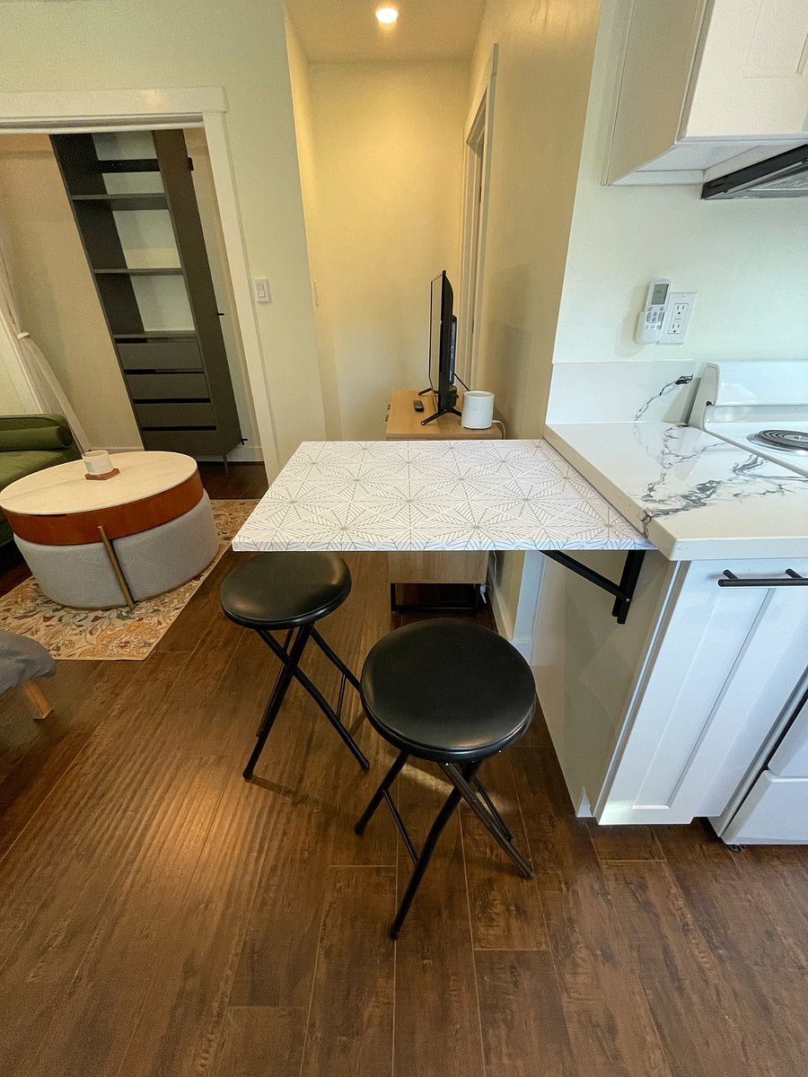 Low profile, foldable table w/c hairs for eating or working.