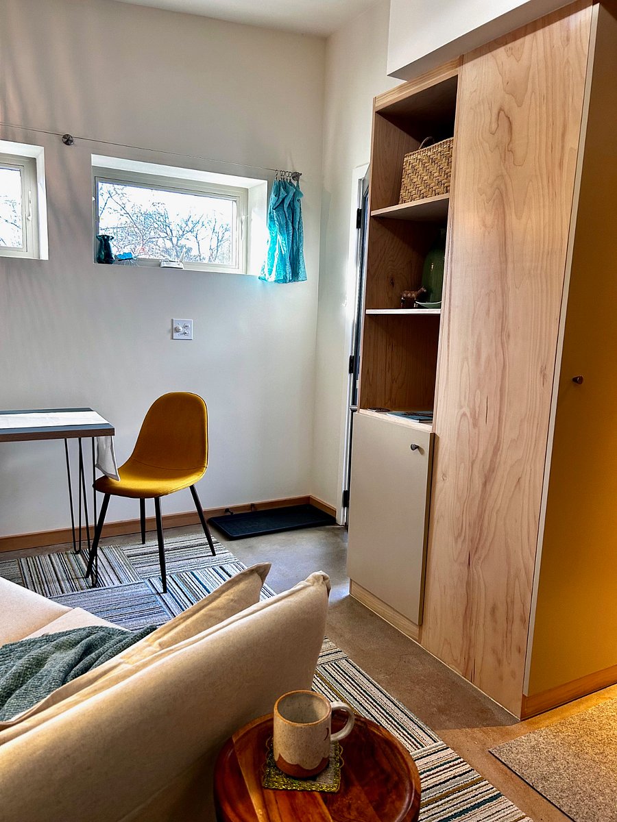 Natural wood Scandi cabinets add additional storage.