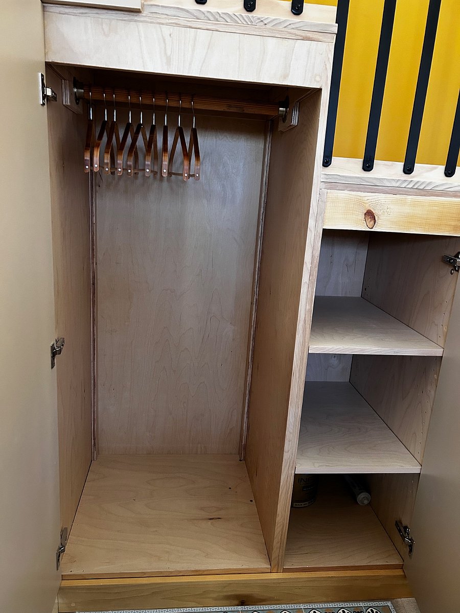 Ample closet and clothing space cleverly tucked under the stairs.