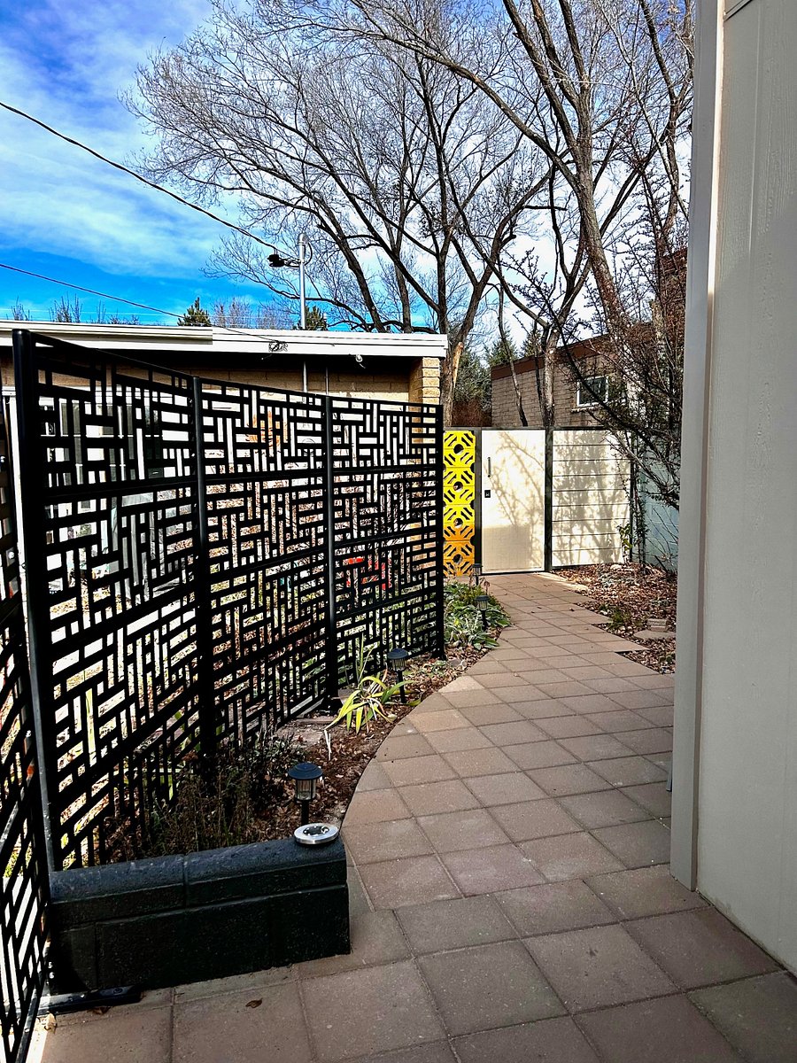 View from the front door of privacy fence, locking gate and 2 spacious patios for morning coffee and evening chill time.