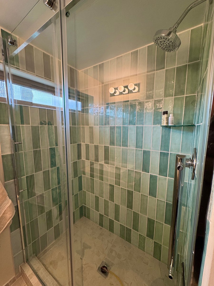 Relax in the spacious aqua under-water feel of the walk-in shower.
