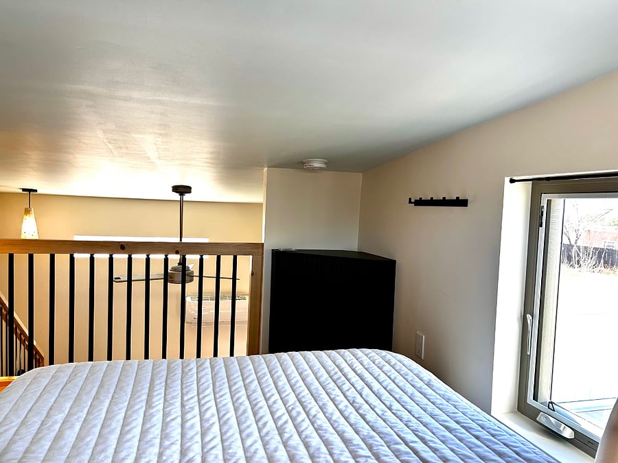 Your view from lounging in the sleeping loft overlooking the main room below.