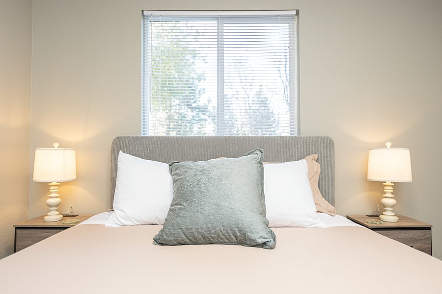 Nightstands on both sides of the bed
