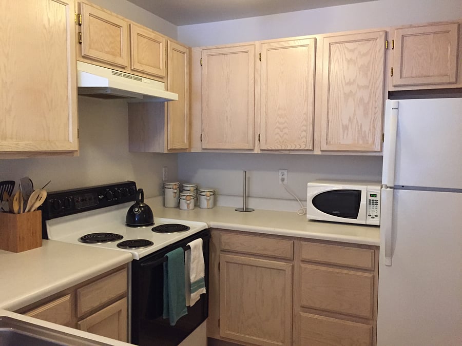 Fully equipped kitchen with cookware, dishes, and full-size appliances
