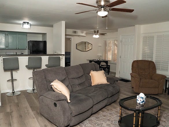 Living room looking into kitchen and dining area