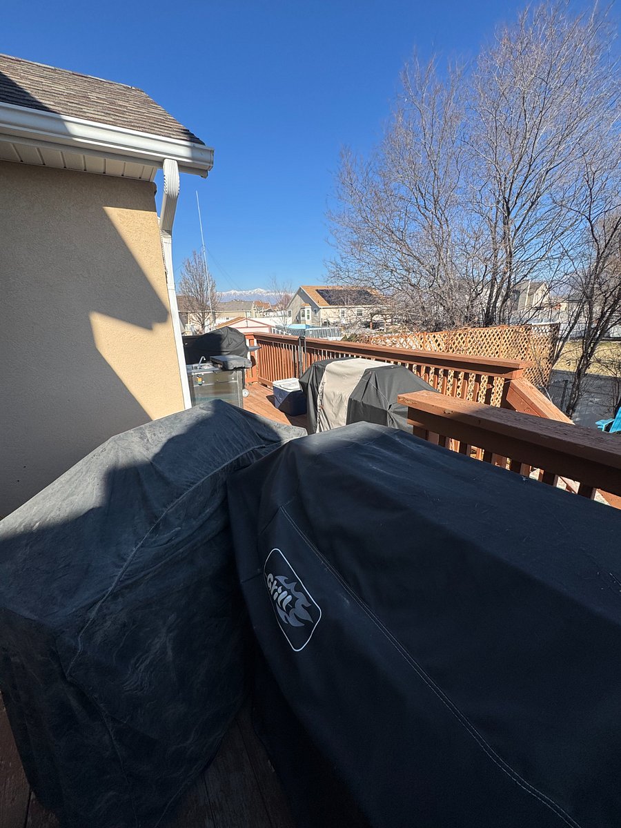 The small deck has a pellet smoker, a briquette grill, and a small propane grill with time is short!