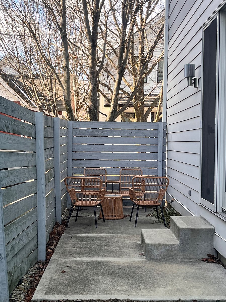 Outdoor patio with furniture. Fenced for privacy.