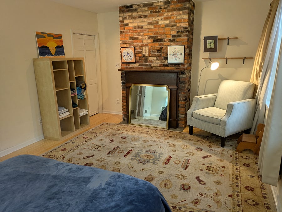 2nd floor bedroom Queen bed, decorative fireplace, arm chair