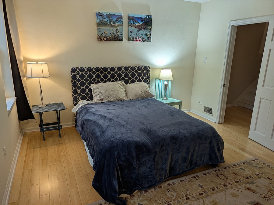 2nd floor bedroom Queen bed, decorative fireplace, arm chair