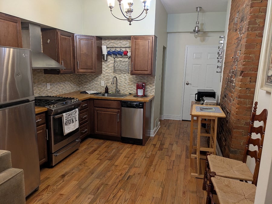 Kitchen, pass through to access pantry and powder room