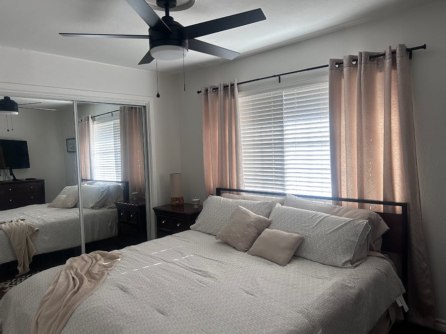 Mirrored closets, blackout curtains, and a brand-new ceiling fan
