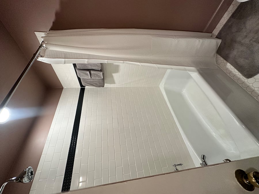 First floor hallway bath with shower tub combo.