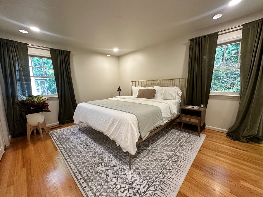 Located on the first floor, this secondary master bathroom has an en suite shower.