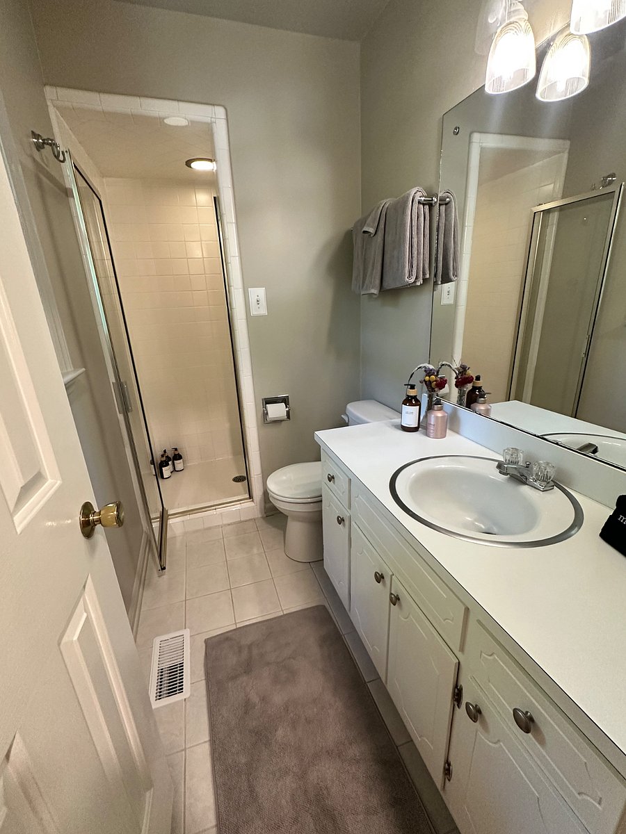 Located on the first floor, the secondary master bedroom's en suite bathroom with shower.