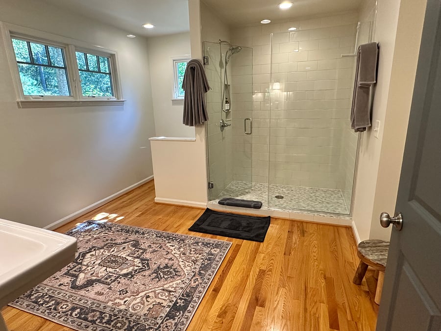 Master bathroom with dual sinks and standing shower.