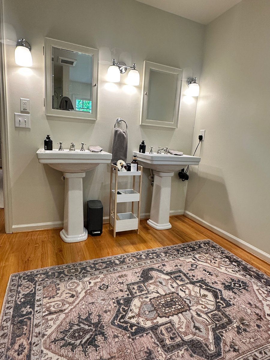 Master bathroom with dual sinks and standing shower.
