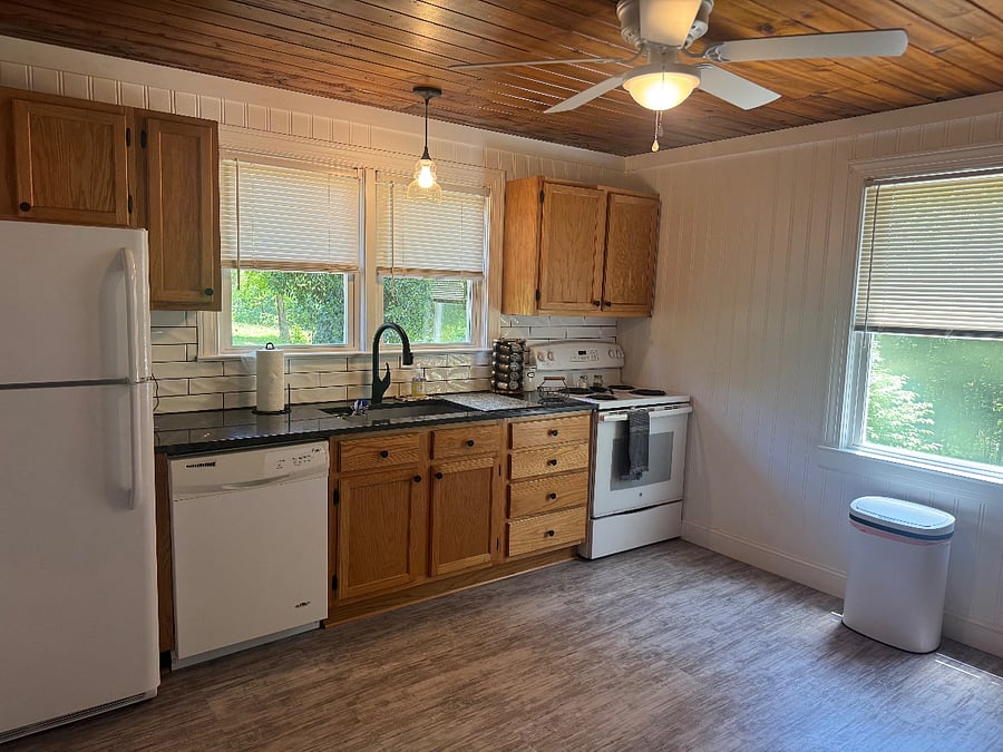 Kitchen - full fridge, stovetop/oven, dishwasher, fully equipped with cooking utensils, flatware and dishes
