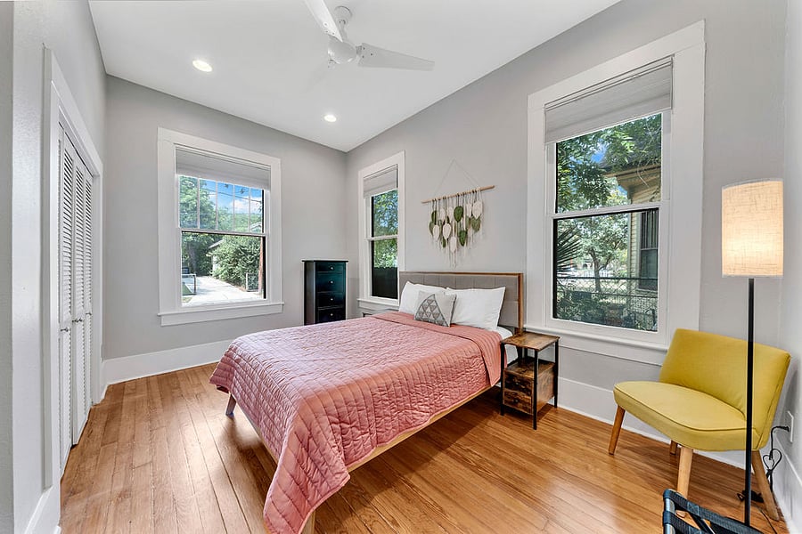 The main bedroom has a queen bed and two large closets.