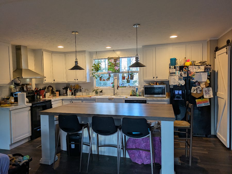 Shared kitchen, open floor plan to living room and dining area
