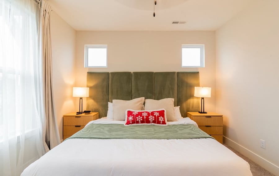 Primary Bedroom, featuring a king sized bed, tv, ensuite bathroom, and large walk in closet